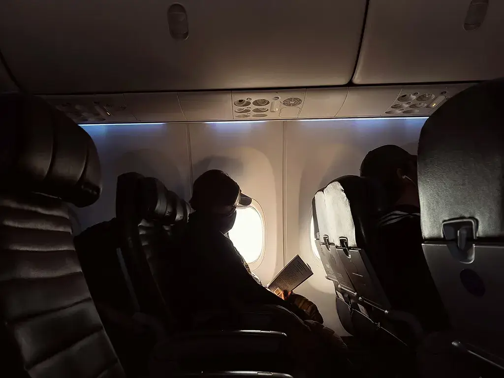 A Senior Traveler on a plane.