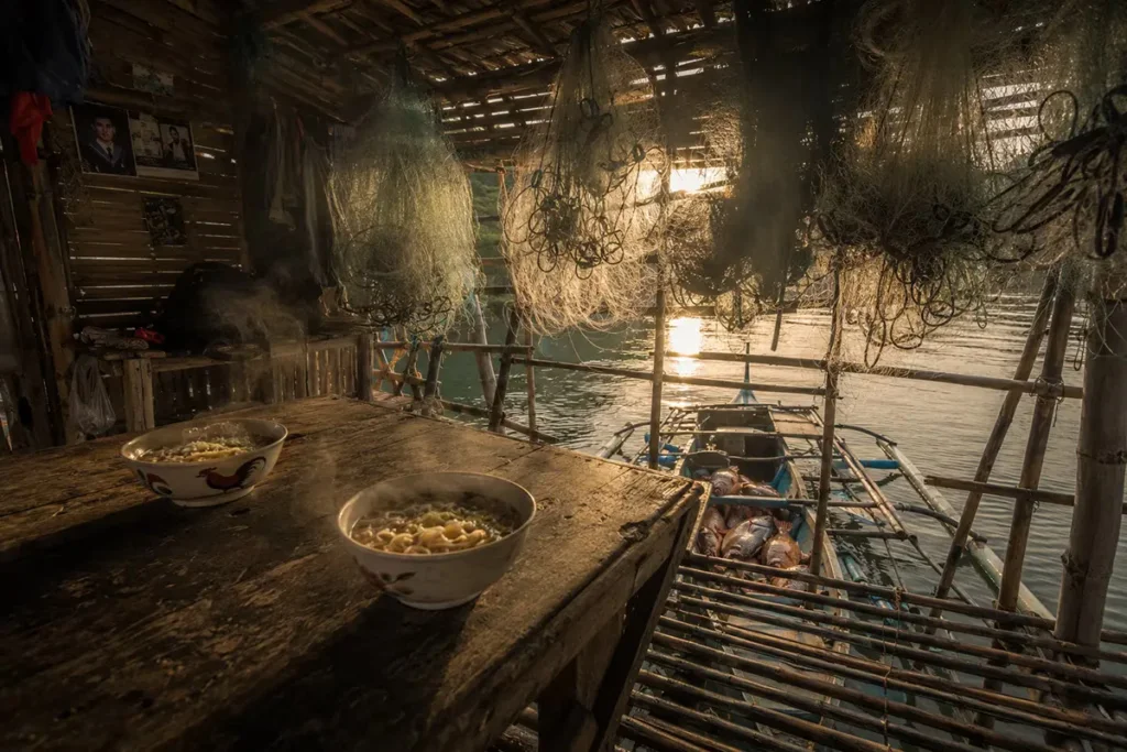 Mindoro fisherman's house with instant noodles and fresh fish catch showing culinary poverty paradox